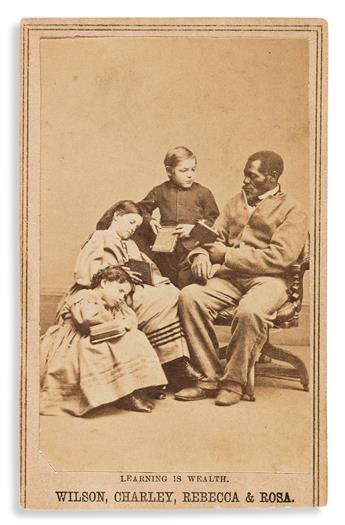 (SLAVERY AND ABOLITION.) Charles Paxson; photographer. Learning is Wealth: Wilson, Charley, Rebecca & Rosa, Slaves from New Orleans.